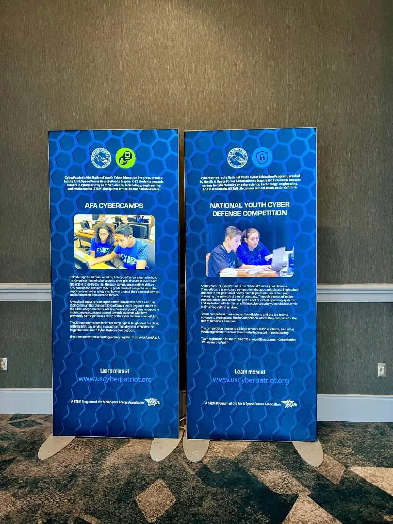 Two CyberPatriot floor stands: AFA CyberCamps and the National Youth Cyber Defense Competition