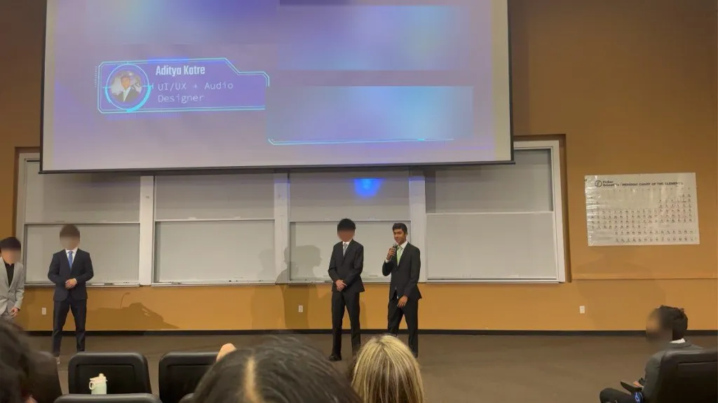 Aditya presenting with his team on stage; teammates' faces and names blurred